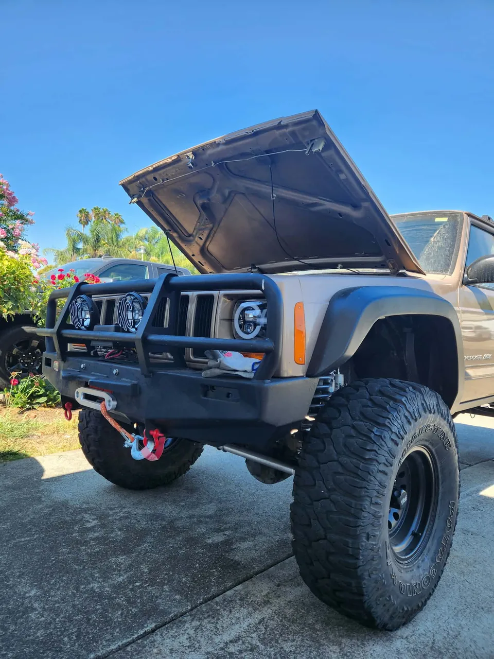 Lifted Jeep Cherokee XJ with aftermarket front bumper