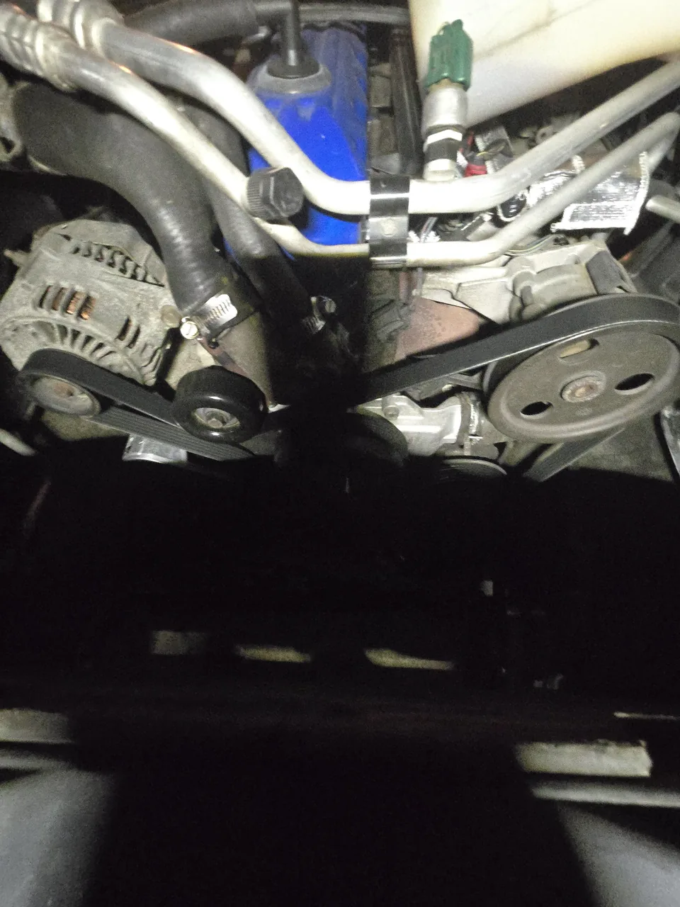 Serpentine belt and alternator seen from under the vehicle